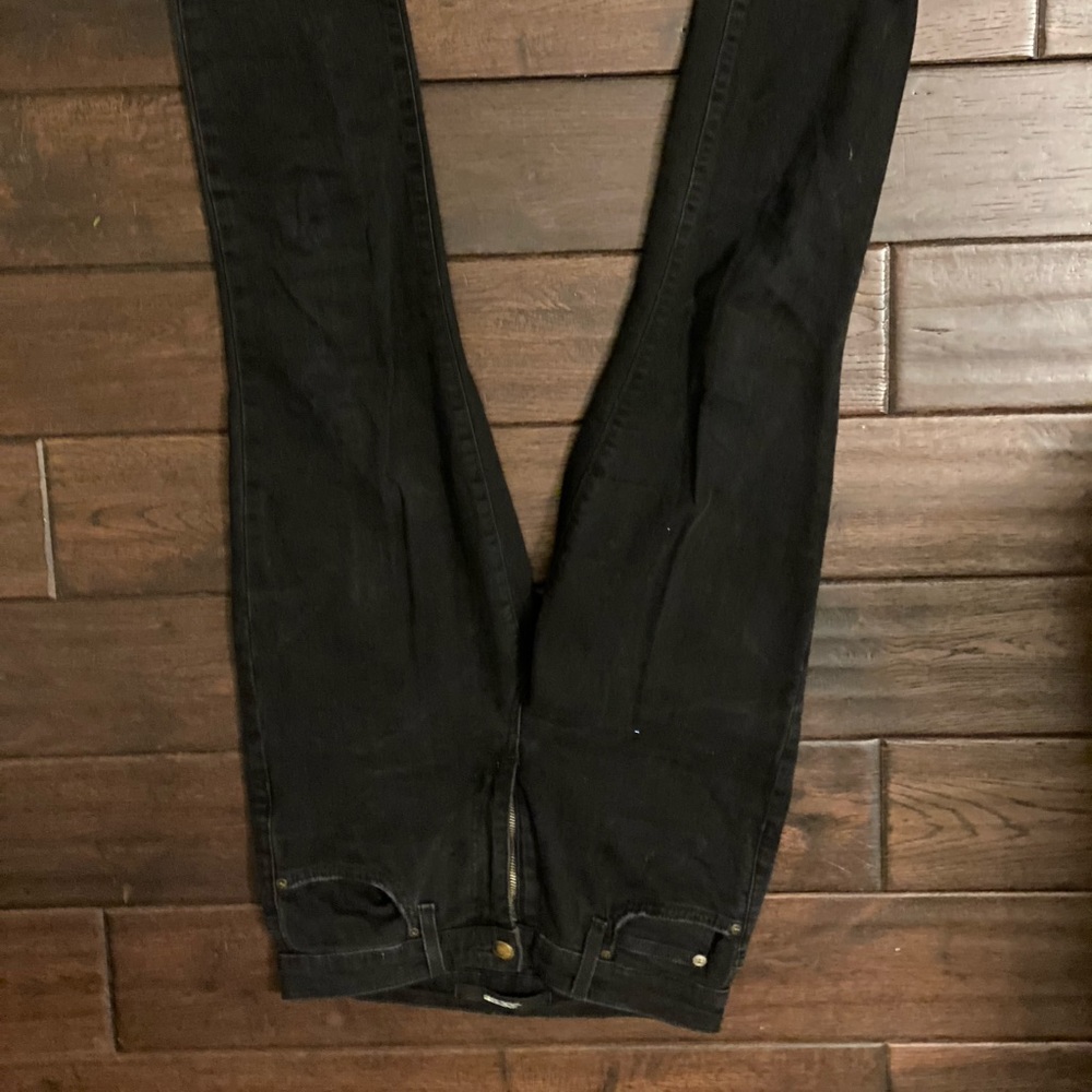 Skinny black jeans with rips.